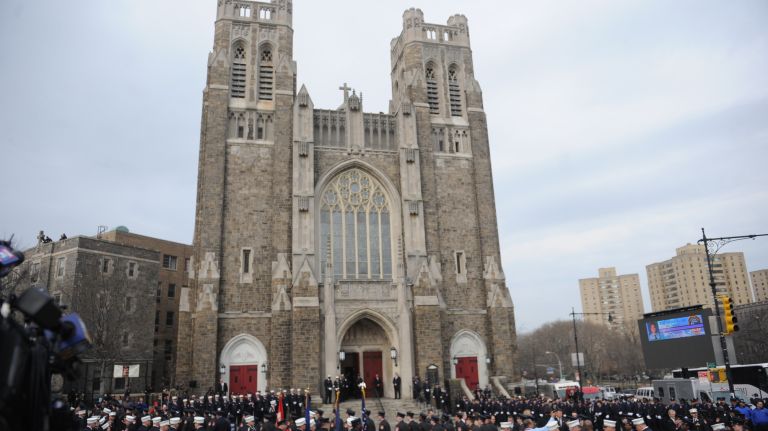 Hundreds gather Saturday, March 25, 2017, for the funeral Mass of slain FDNY EMT Yadira Arroyo. Services were at St. Nicholas of Tolentine Roman Catholic Church on University Avenue in the Bronx.
