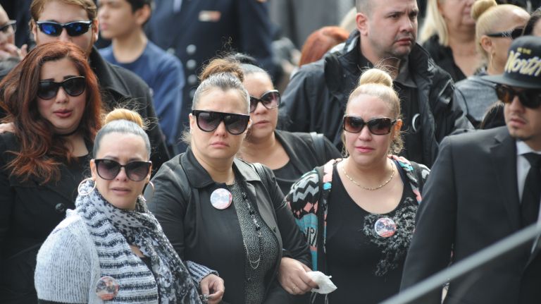 Friends and family members arrive Saturday, March 25, 2017, at St. Nicholas of Tolentine Roman Catholic Church on University Avenue in the Bronx for the funeral of FDNY EMT Yadira Arroyo.