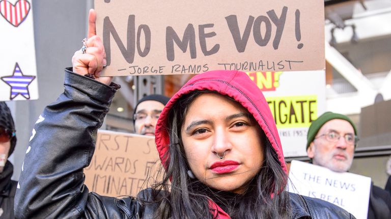 A protester joins the rally outside the New York Times building in midtown Manhattan during the March for a Free Press on Feb. 26, 2017.