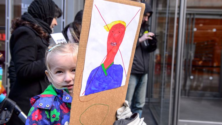 One of the younger protesters shows her support outside the New York Times building in midtown Manhattan during the March for a Free Press on Feb. 26, 2017.
