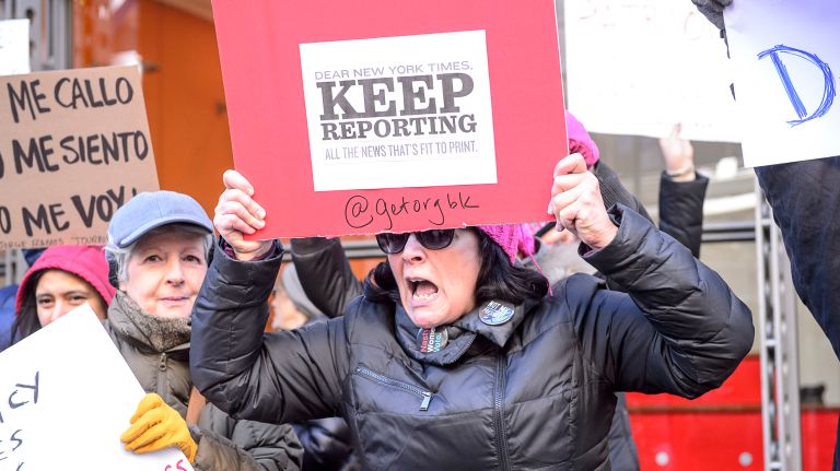 Protesters hold up signs during the March for a Free Press, held outside the New York Times building in midtown Manhattan on Feb. 26, 2017. 