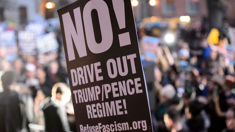 A protest sign is held during a rally in support of transgender youth at the Stonewall National Monument in Greenwich Village on Feb. 23, 2017.
