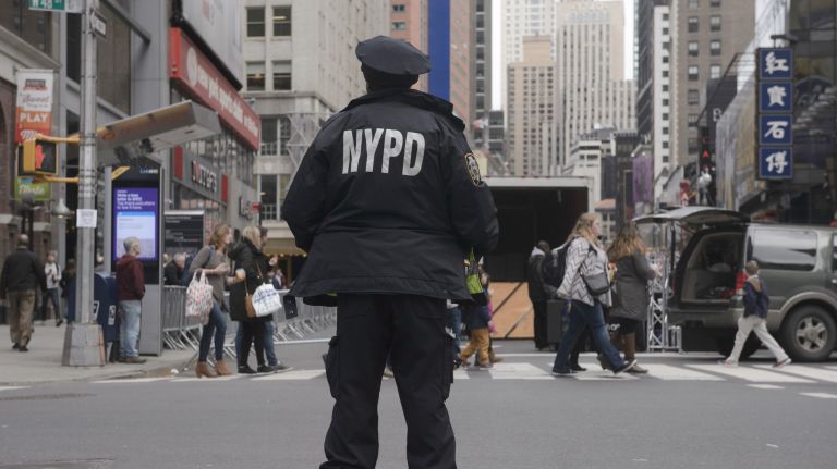 An NYPD officer stands in Times Square before the I Am A Muslim Too rally on Feb. 19, 2017.