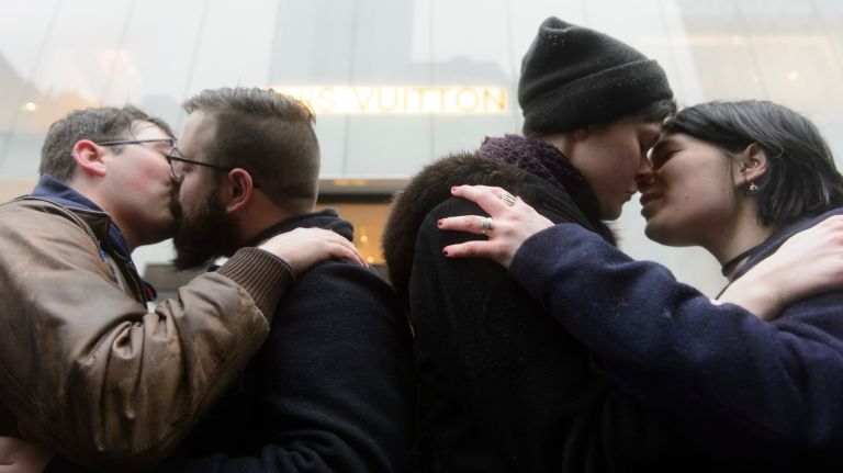 LGBT rally at Trump Tower: Photos of the midtown Manhattan protest 29 Members of the LGBT community and their allies kiss on Fifth Avenue near Trump Tower in Manhattan on Sunday, Feb. 12, 2017. Members of the community rallied near the building to show solidarity for underprivileged groups.