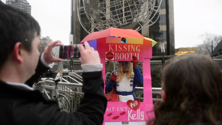 LGBT rally at Trump Tower: Photos of the midtown Manhattan protest 30 Mike Hisey, 54, donning a Kellyanne Conway Inauguration Day-inspired red, white and blue coat, stands inside a makeshift kissing booth tucked during the rally on Feb. 12, 2017.