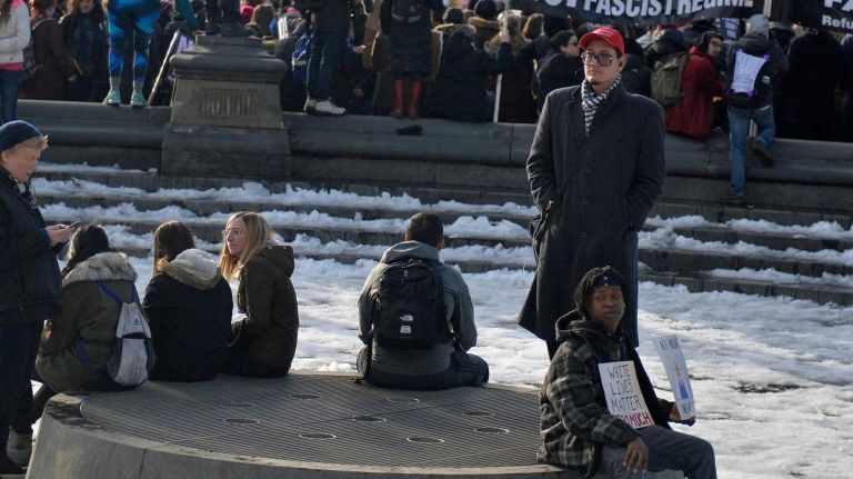 An African American man has a distinct message during an immigration rally Washington Square Park on Saturday, Feb. 11, 2017. The rally was held to challenge the criminalization of immigrants under the NYPD's current Broken Windows policy, before it worsens under President Trump's far-right administration.