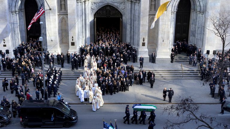 Pallbearers carry the coffin of NYPD Det. Steven McDonald from St. Patrick's Cathedral on Friday, Jan. 13, 2017, following a funeral for McDonald.