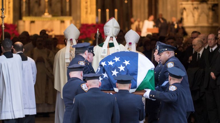 NYPD Det. Steven McDonald's body is carried into St. Patrick Cathedral on Friday Jan 13, 2017.