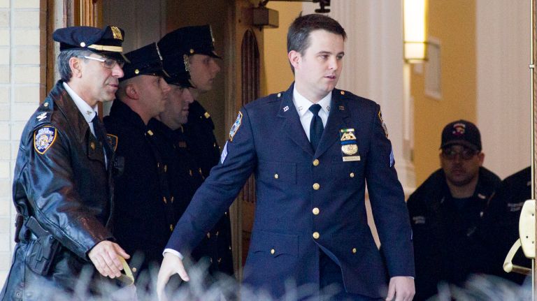 Sgt. Conor McDonald leaves the Parish Center at St. Agnes Cathedral prior to the coffin of his father Det. Steven McDonald on Friday, Jan. 13, 2017 in Rockville Centre.