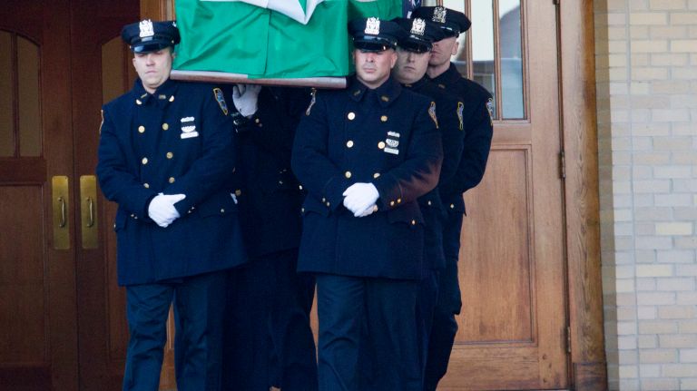 The coffin of Det. Steven McDonald leaves the Parish Center at St. Agnes Cathedral on Friday, Jan. 13, 2017 in Rockville Centre.