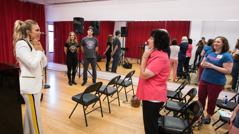 Platten's teaching methods involved loosening the jaw and singing with only vowel sounds to find the melody before adding in lyrics.