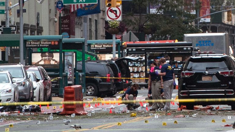 Chelsea explosion injures multiple people in Manhattan: See photos from the scene 9 FBI agents review the crime scene on W. 23rd Street in Manhattan's Chelsea neighborhood on Sept. 18, 2016.