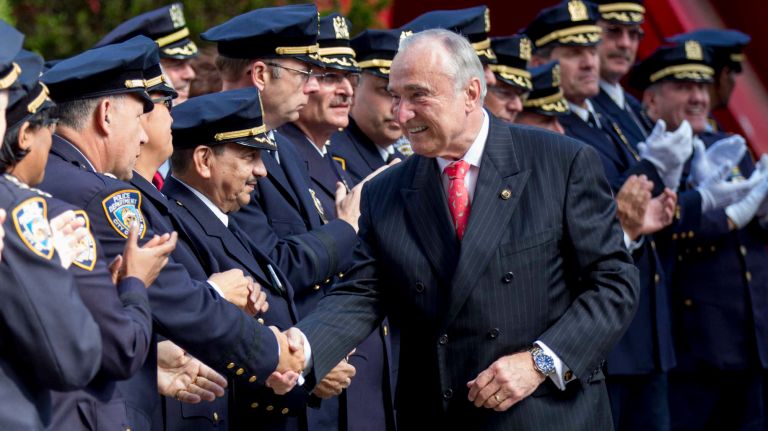 Bill Bratton shakes hands with police officers as he leaves 1 Police Plaza on Sept. 16, 2016, his final day as police commissioner.
