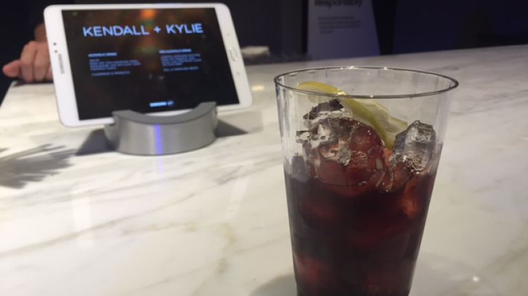 But the Jenner sisters (who aren't yet of legal drinking age -- Kylie is 19 and Kendall is 20) did create, or had someone create for them, a custom cocktail for the pop-up called the Tokyo (pictured). It's made with Tito's vodka, pomegranate juice and Lucien Jacob Framboise liqueur. 