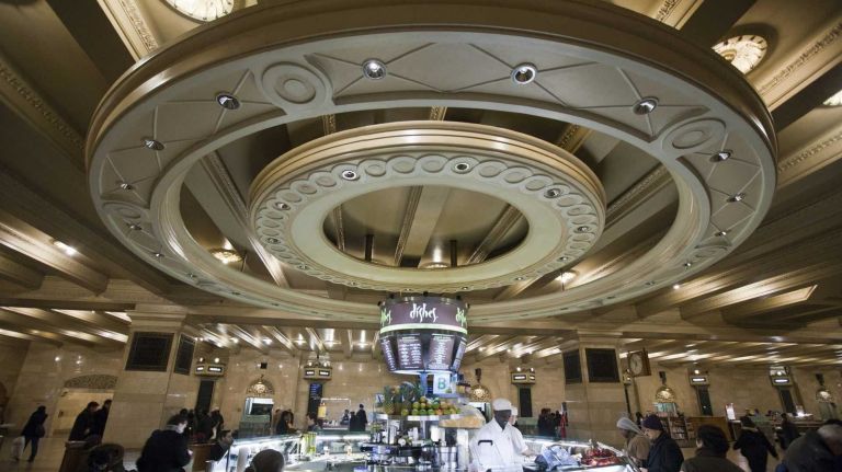 Commuters dine at the food court area, relatively new to the downstairs area, while they wait in Grand Central Terminal in Manhattan which is celebrating its centennial February 2013. (Jan. 24, 2013) Photo by Natan Dvir