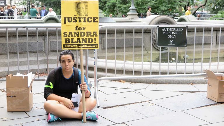 One protester showed support for Sandra Bland, who was found dead last summer in a Texas jail not long after her arrest by a Texas state Trooper in a traffic stop. 