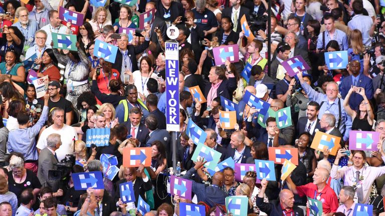 The New York Delegation and others on the floor raise signs in support of Hillary Clinton at the Democratic National Convention at the Wells Fargo Center in Philadelphia on Tuesday, July 26, 2016.