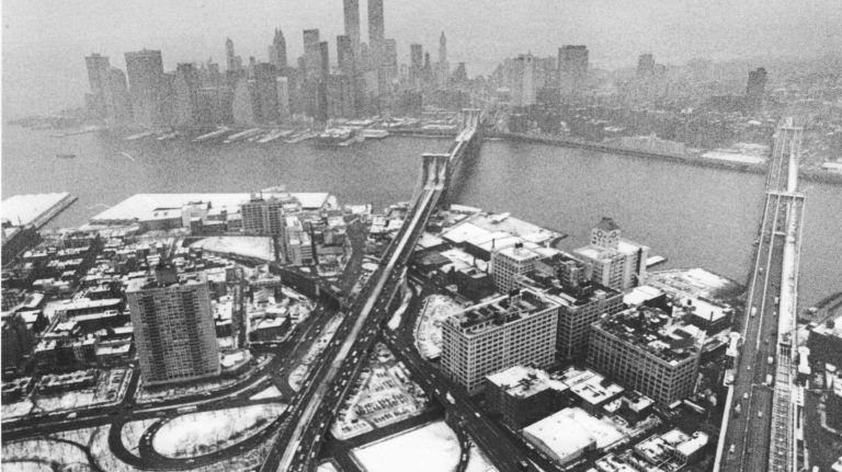 A snowy New York City skyline with the Brooklyn Bridge and Manhattan Bridge in the foreground on Jan. 21, 1987.