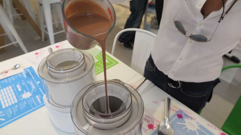 After turning the churning machine on, you pour in your base of choice.