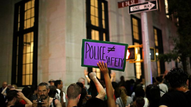 Demonstrators march through Manhattan on July 7, 2016, to protest the deaths of two black men at the hands of police in Louisiana and Minnesota. 