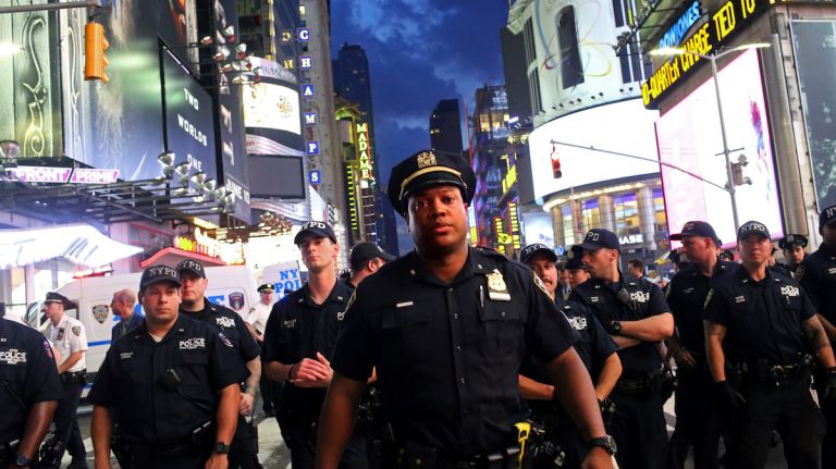 NYPD officers were out and about as demonstrators marched through Manhattan on July 7, 2016, to protest the deaths of two black men at the hands of police in Louisiana and Minnesota. 
