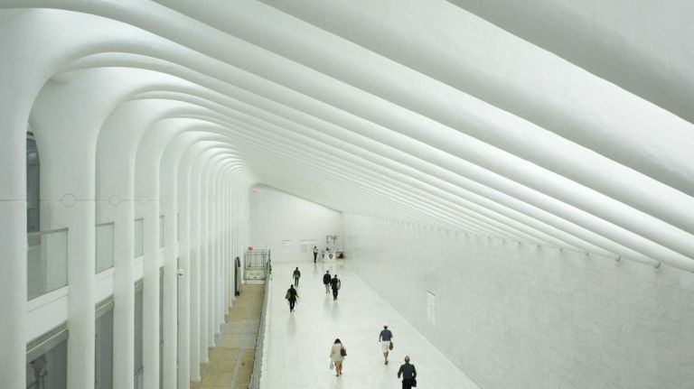 Pedestrians walk through the west concourse of the World Trade Center Transportation Hub, known as the Oculus. 