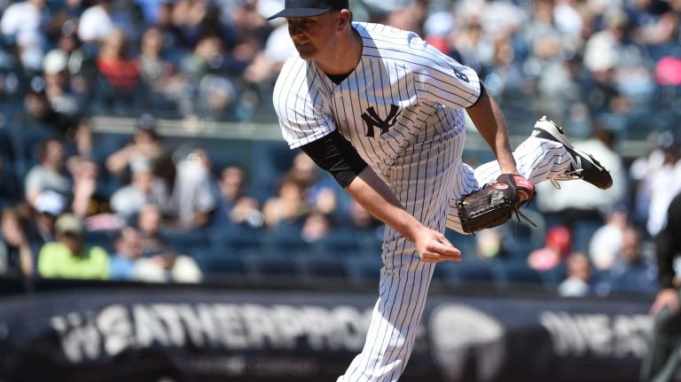 Yankees vs. Rays 61 New York Yankees relief pitcher Kirby Yates follows through on his pitch against the Tampa Bay Rays during the sixth inning of an MLB baseball game at Yankee Stadium on Sunday, April 24, 2016.