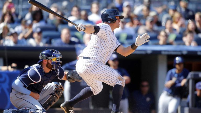 Yankees vs. Rays 74 Brett Gardner #11 of the New York Yankees follows through on a seventh inning RBI infield base hit against the Tampa Bay Rays at Yankee Stadium on Saturday, April 23, 2016 in the Bronx Borough of New York City.