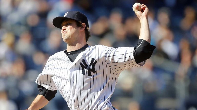 Yankees vs. Rays 75 Andrew Miller #48 of the New York Yankees pitches in the ninth inning against the Tampa Bay Rays at Yankee Stadium on Saturday, April 23, 2016 in the Bronx Borough of New York City.