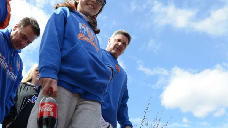 Sarah Piccolo of York, Pa., stands outside Citi Field before the Mets' home opener against the Philadelphia Phillies on Friday, April 8, 2016.