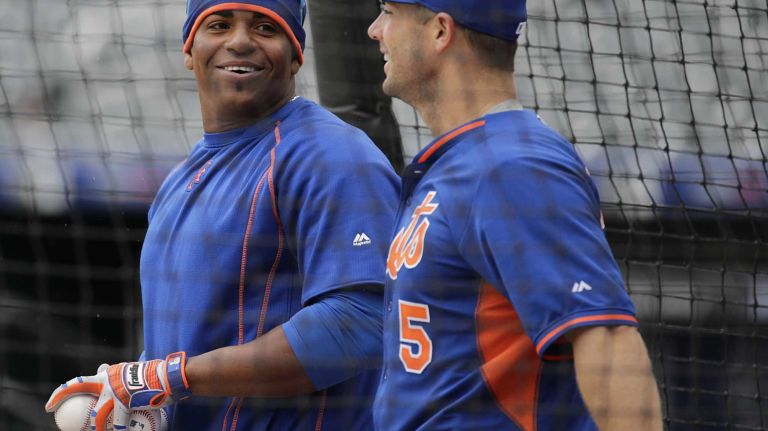 New York Mets leftfielder Yoenis Cespedes, No. 52, and third baseman David Wright, No. 5, look on during batting practice before the Mets' home opener against the Philadelphia Phillies on Friday, April 8, 2016, at Citi Field.