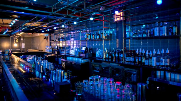 The bar's shelving is made from custom copper pipes.