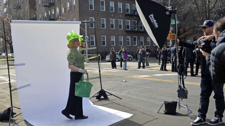 Lady Clover Honey, 53, of Manhattan, poses for photographs before the start Sunday, March 6, 2016, of the St. Pat's for All Parade on Skillman Avenue and 43rd Street in Sunnyside.