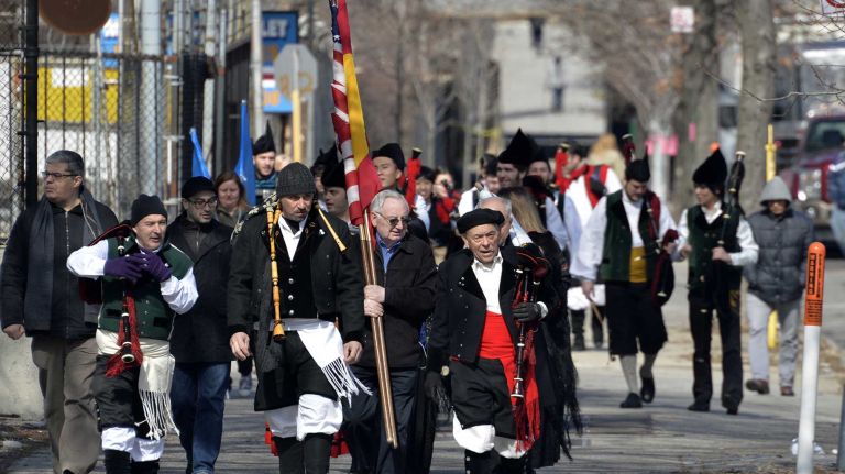 Members of the Queens Centro Español Pipe and Drum Band arrive at the starting place for the St. Pat's for All Parade Sunday, March 6, 2016, in Sunnyside.
