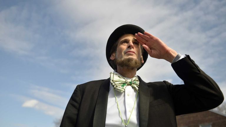 Gary Rissman, 50, of Manhattan, who says he is a volunteer photographer, is ready for the start of the St. Pat's for All Parade on Sunday, March 6, 2016, at Skillman Avenue and 43rd Street in Sunnyside. 