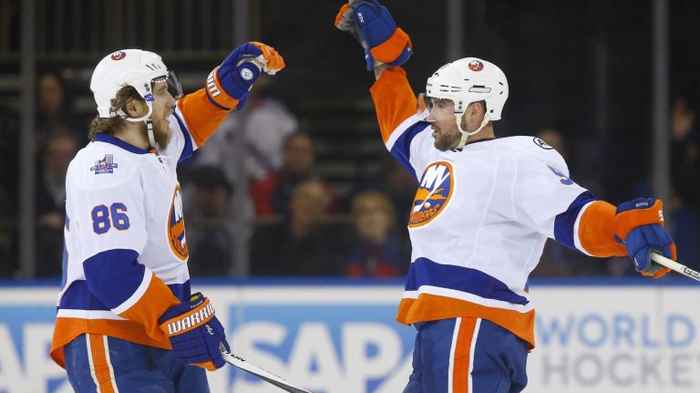 Islanders vs. Rangers 22 Johnny Boychuk of the New York Islanders celebrates second goal of the first period against the New York Rangers with teammate Nikolay Kulemin at Madison Square Garden on Sunday, March 6, 2016.