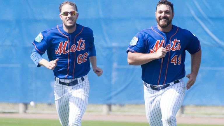 New York Mets pitchers Erik Goeddel (left) and Josh Smoker run n Sunday Feb. 28, 2016 during a spring training workout in Port St. Lucie, Fla.