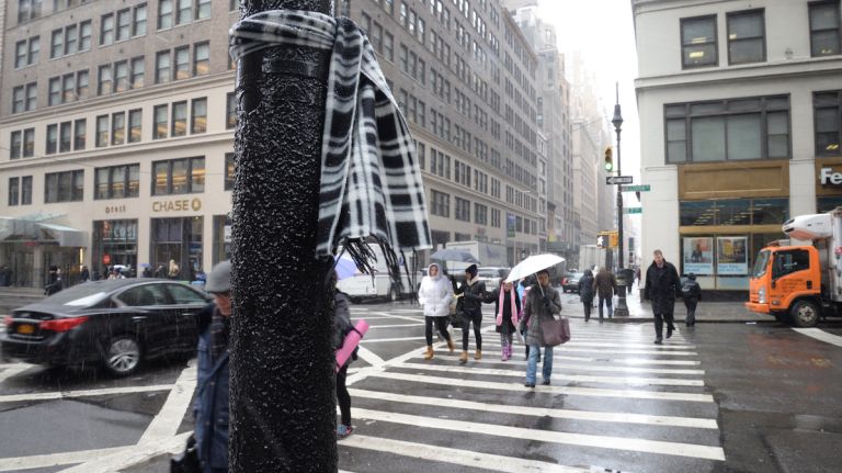 NYC weather: Light snow coats Manhattan 7 Forgot a scarf at home? Be on the lookout for winter weather attire such as this, as seen on Monday, Feb. 8, 2016.