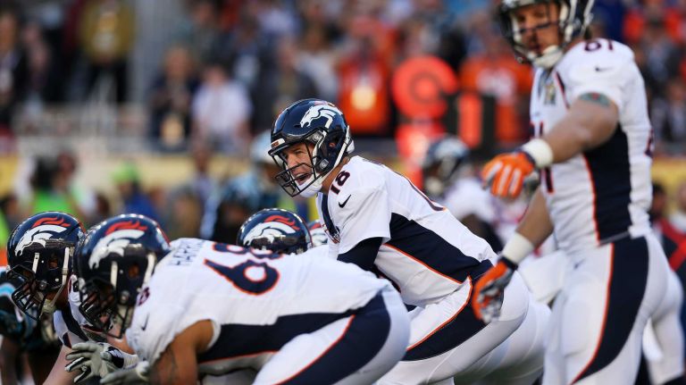 Super Bowl 50: Panthers vs. Broncos 13 Peyton Manning of the Denver Broncos prepares to hike the ball in the first quarter against the Carolina Panthers during Super Bowl 50 at Levi's Stadium on February 7, 2016 in Santa Clara, Calif.