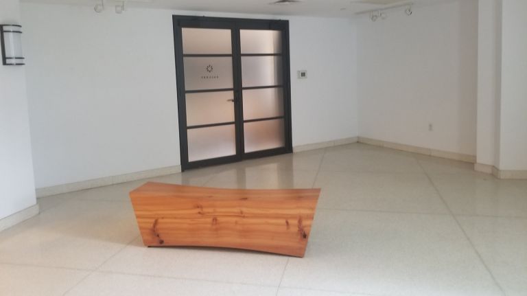 The gallery space in The Octagon is now empty, except for a wood bench.