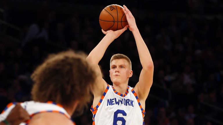 Kristaps Porzingis #6 of the New York Knicks hits a three-point shot against the Charlotte Hornets at Madison Square Garden on Tuesday, Nov. 17, 2015.
