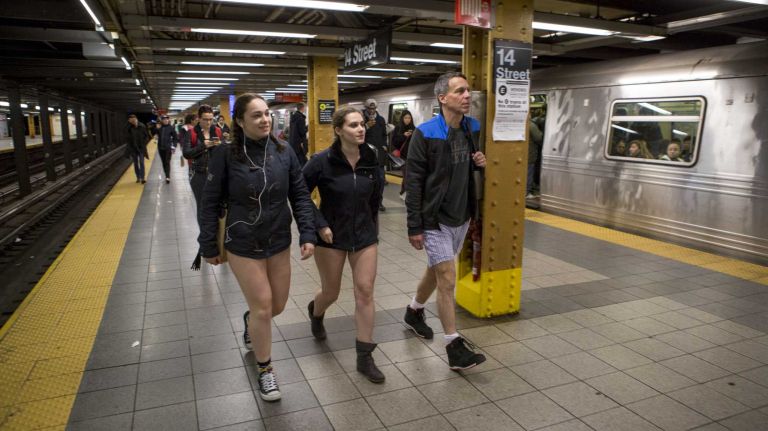 Participants in the No Pants Subway Ride exit a train in New York on Jan. 10, 2016.