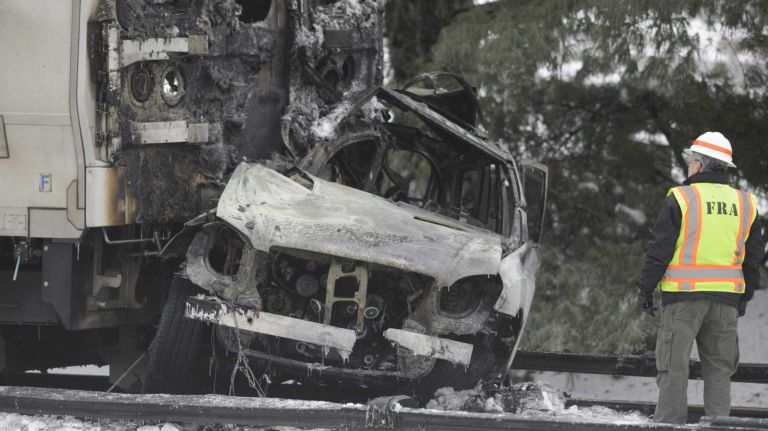 NYC pictures of 2015: Pope Francis, Pizza Rat, Shia LaBeouf, Donald Trump and more 30 Investigators examine the charred car of a Metro-North commuter train the morning after it struck a SUV in Valhalla, Wednesday, Feb. 4, 2015. Six people, including the driver, were killed in the accident.