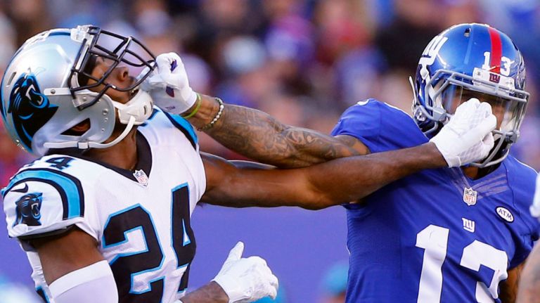 Odell Beckham Jr. vs. Josh Norman 15 Odell Beckham of the New York Giants mixes it up after a play in the first half against Josh Norman of the Carolina Panthers at MetLife Stadium on Sunday, Dec. 20, 2015 in East Rutherford, New Jersey.