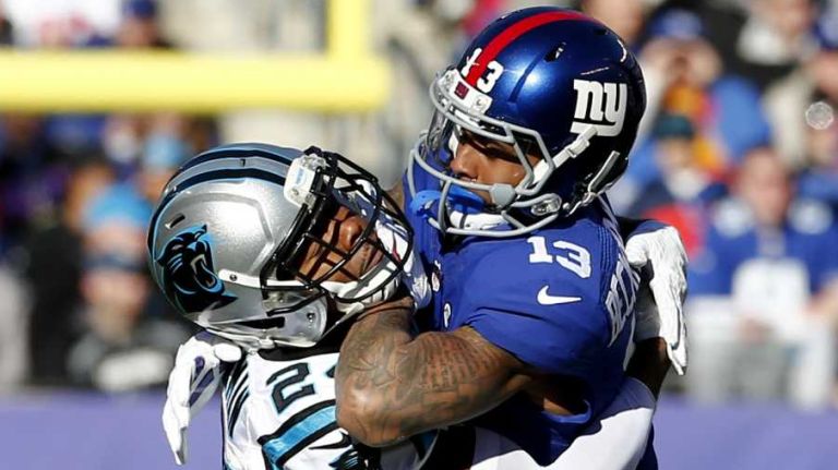 Odell Beckham Jr. vs. Josh Norman 19 Josh Norman #24 of the Carolina Panthers throws Odell Beckham #13 of the New York Giants to the ground at MetLife Stadium on Dec. 20. 2015 in East Rutherford, N.J.