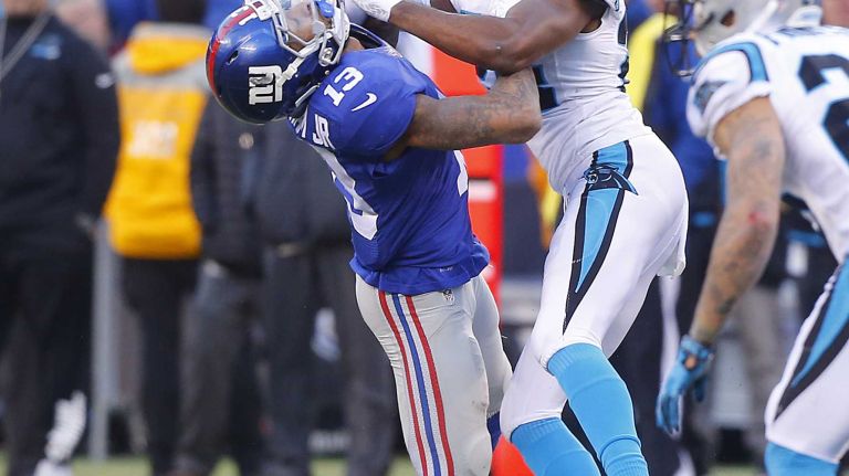 Odell Beckham Jr. vs. Josh Norman 20 Odell Beckham #13 of the New York Giants is hit after a snap in the second half by Josh Norman #24 of the Carolina Panthers at MetLife Stadium on Sunday, Dec. 20, 2015 in East Rutherford, New Jersey.