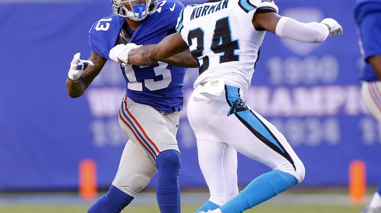 Odell Beckham Jr. vs. Josh Norman 22 Odell Beckham #13 of the New York Giants looks for room in the first half against Josh Norman #24 of the Carolina Panthers at MetLife Stadium on Sunday, Dec. 20, 2015 in East Rutherford, New Jersey.
