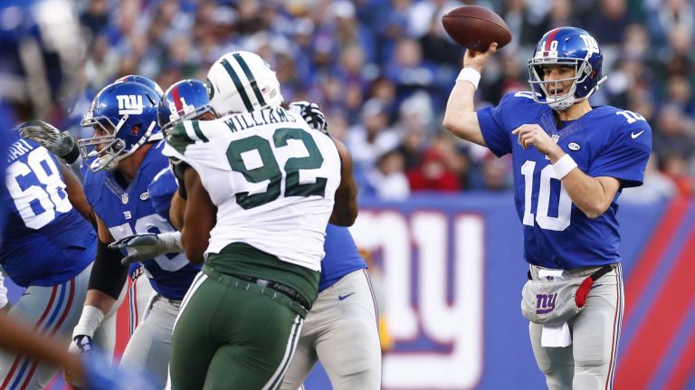 Eli Manning #10 of the New York Giants looks to pass the ball against the New York Jets at MetLife Stadium on Sunday, Dec. 6, 2015 in East Rutherford, N.J.