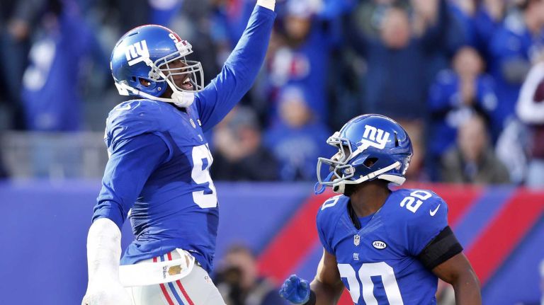 Jason Pierre-Paul #90 of the New York Giants celebrates his fumble recovery in the first half against the New York Jets with teammate Prince Amukamara #20 at MetLife Stadium on Dec. 6, 2015 in East Rutherford, N.J.