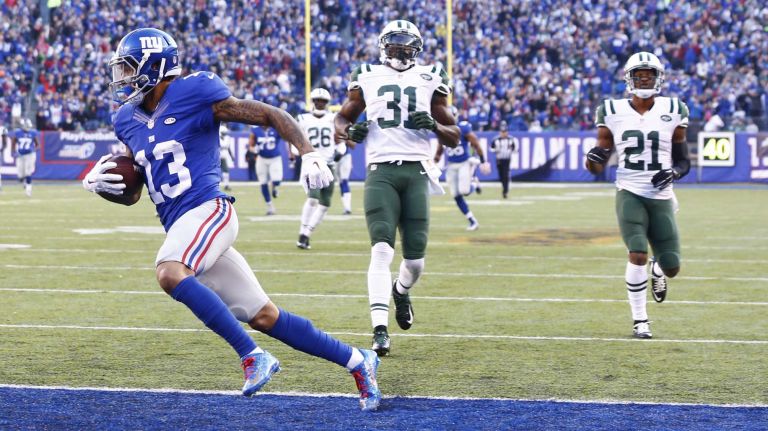Odell Beckham #13 of the New York Giants runs with the ball after the catch for a touchdown against the New York Jets at MetLife Stadium on Dec. 6, 2015 in East Rutherford, N.J.